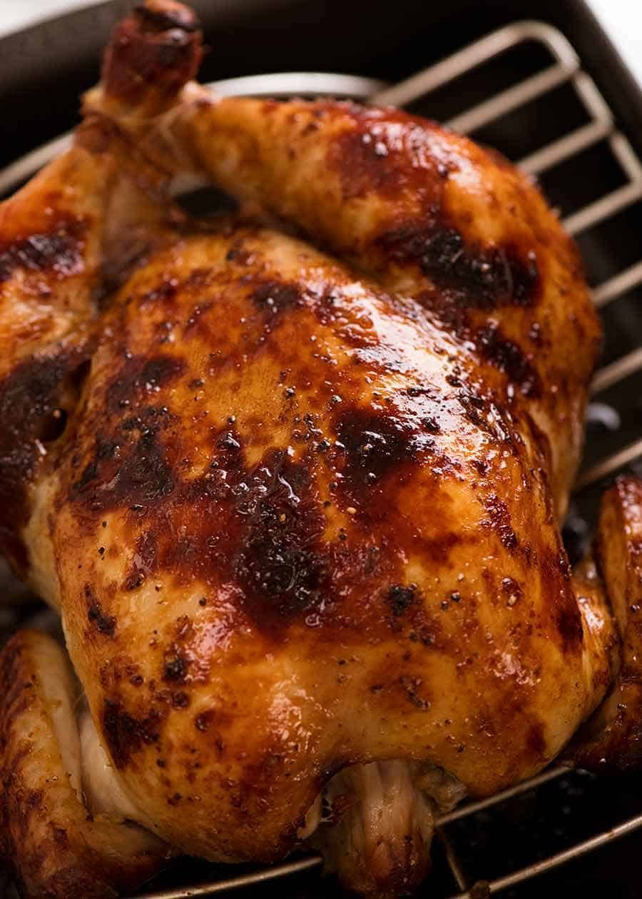 Photo of the juiciest roast chicken fresh out of the oven, ready to be served