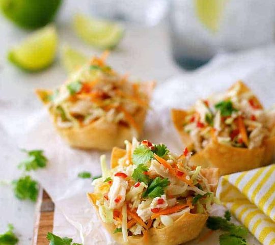 A serving board of Thai Chicken Salad Wonton Cups