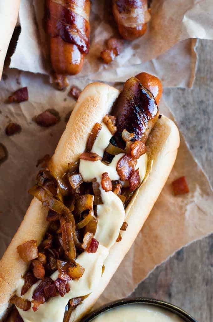 Bacon Wrapped Hot Dogs with Cheese Sauce closeup photo