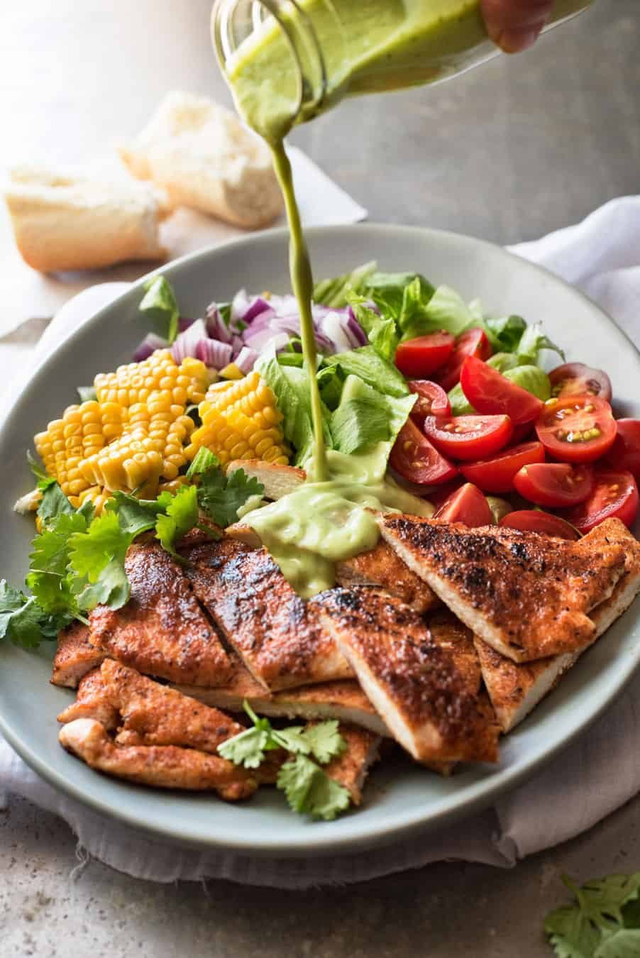 Chicken Salad with Avocado Dressing, with tomatoes, corn, lettuce and onion