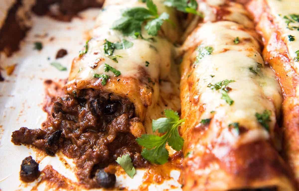The BEST Beef Enchiladas, with an extra tasty, extra saucy filling and the most incredible homemade Enchilada Sauce! staging.recipetineats.com