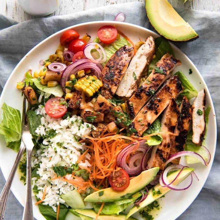 A salad with chicken marinated in pineapple juice, coconut milk & spices and a beautiful cilantro (coriander) lime dressing. The flavours of Hawaii - in a salad! staging.recipetineats.com