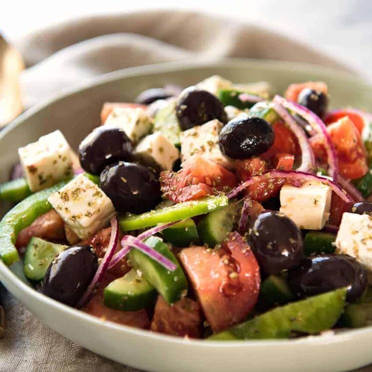 A classic Greek Salad with plump olives and a beautiful homemade Greek Salad Dressing. staging.recipetineats.com