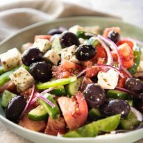 A classic Greek Salad with plump olives and a beautiful homemade Greek Salad Dressing. staging.recipetineats.com
