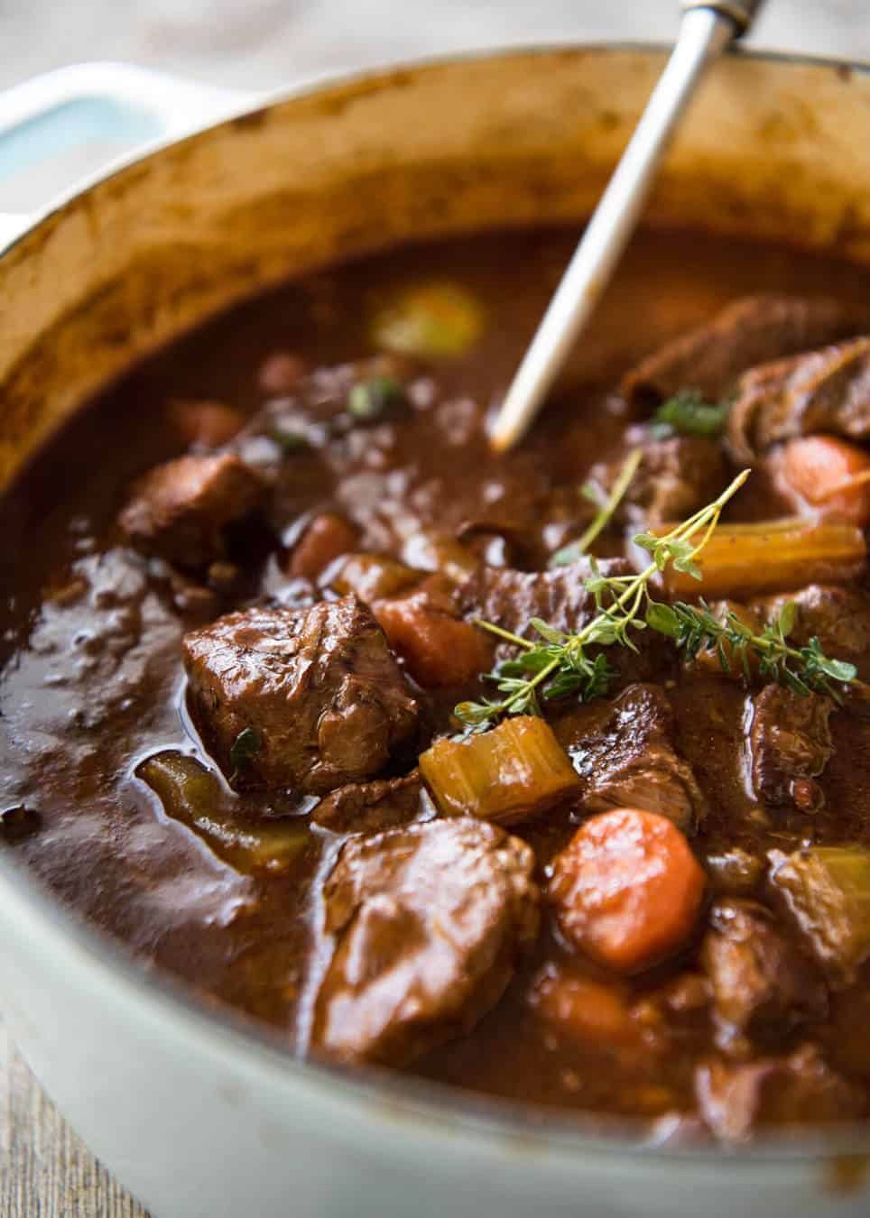 Irish Beef and Guinness Stew - The king of all stews! Fork tender beef in a rich thick sauce. Easy to make, just requires patience! Slow cooker, stove, oven and pressure cooker directions provided. staging.recipetineats.com