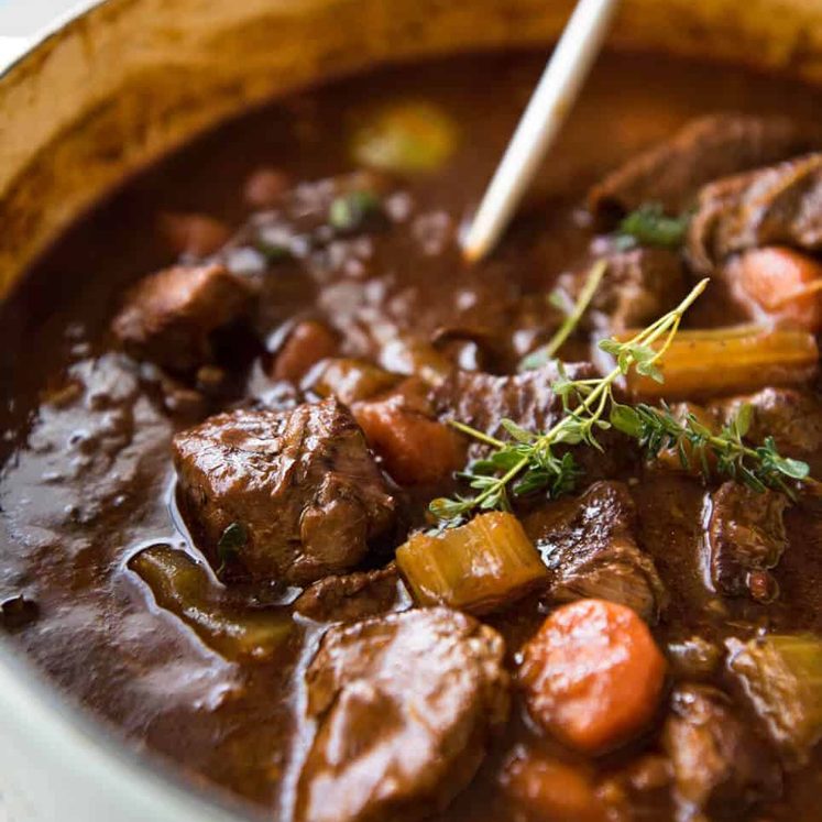 Irish Beef and Guinness Stew - The king of all stews! Fork tender beef in a rich thick sauce. Easy to make, just requires patience! Slow cooker, stove, oven and pressure cooker directions provided. staging.recipetineats.com