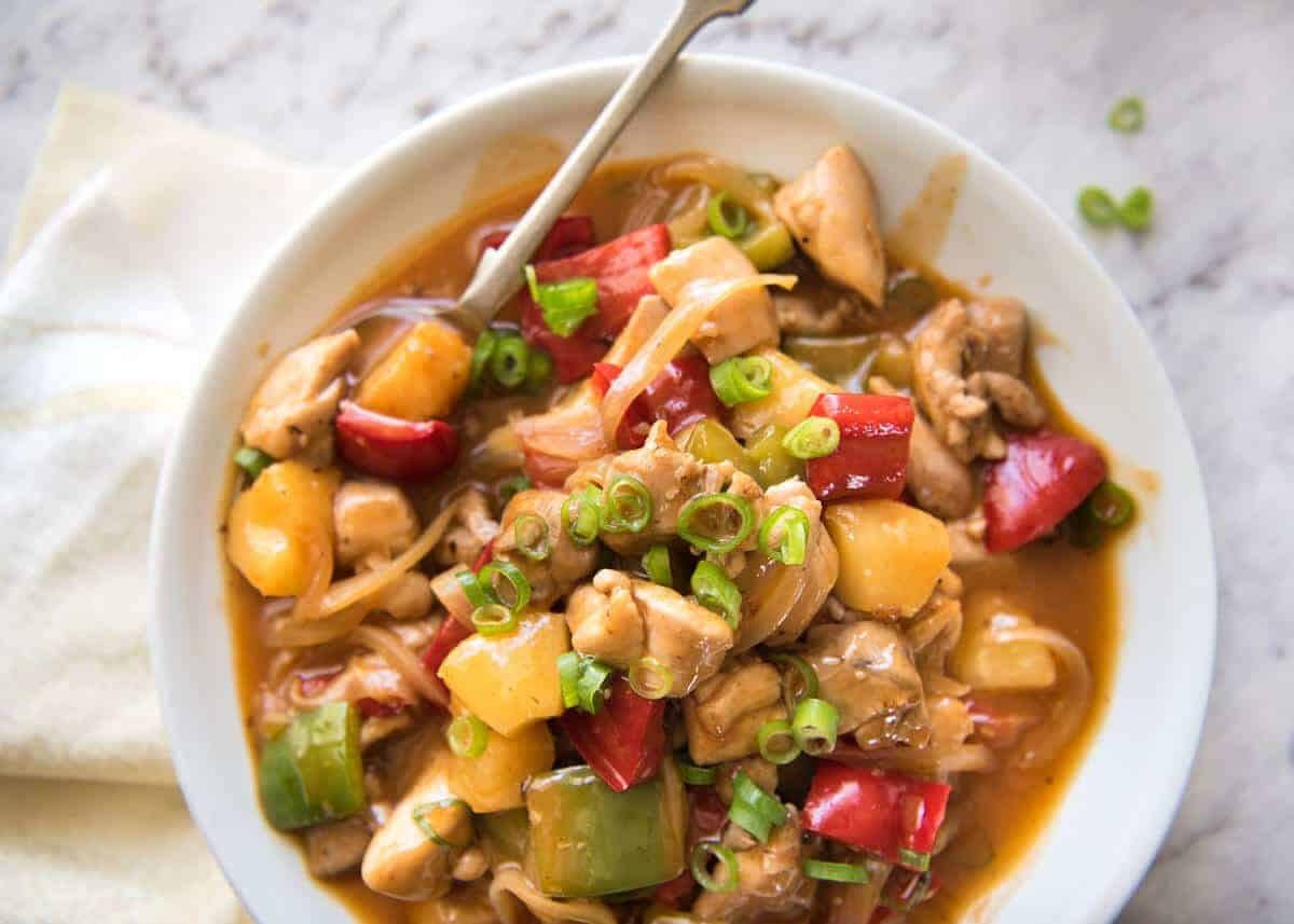 Bright and colourful, this Sweet and Sour Chicken Stir Fry is made with a sauce that rivals the best Chinese restaurants! staging.recipetineats.com