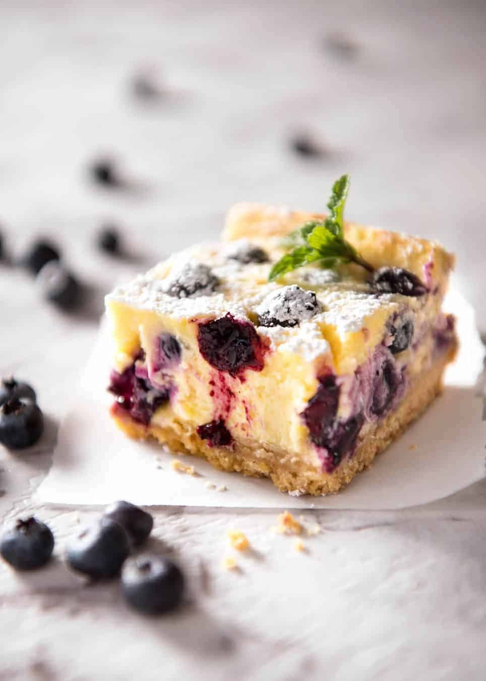 These Blueberry Cheesecake Bars are light yet creamy and luscious. Filled with soft blueberries, this is a baked cheesecake that's so easy to make! staging.recipetineats.com