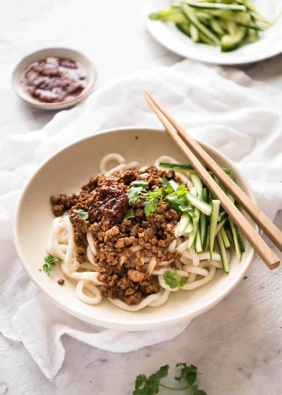 Chinese Pork Mince with Noodles (Zha Jiang Mian) - Super quick and super tasty, affectionally known as "Chinese Bolognese". The pork is savoury with a touch of heat and spice, perfect mixed through noodles! staging.recipetineats.com