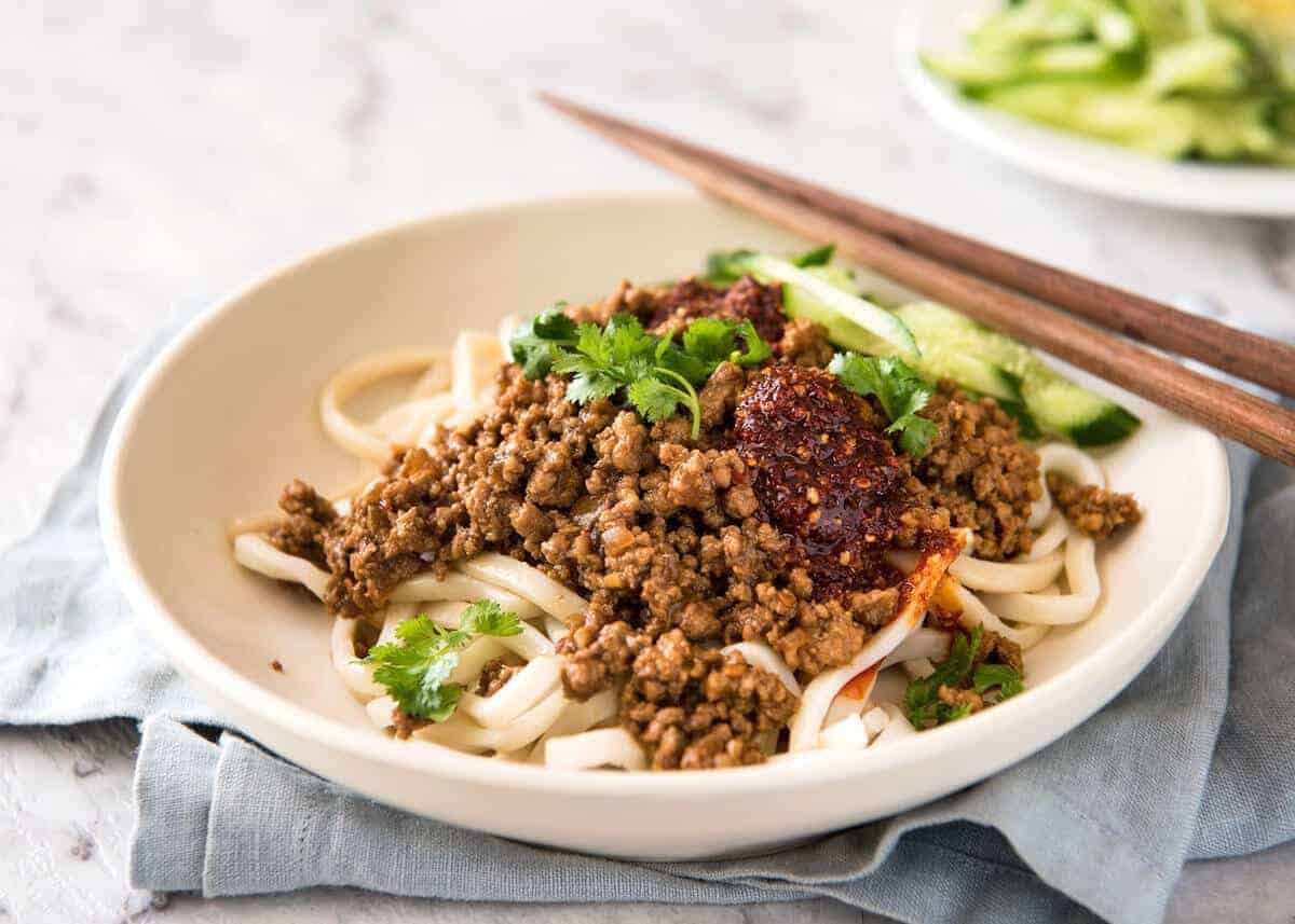 Chinese Pork with Noodles (Zha Jiang Mian) - Super quick and super tasty, affectionally known as "Chinese Bolognese". The pork is savoury with a touch of heat and spice, perfect mixed through noodles! staging.recipetineats.com