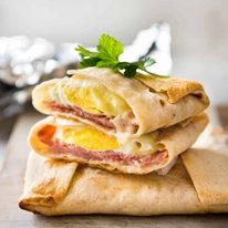 No Washing Up Ham Egg Cheese Pockets - Place ham on a wrap/tortilla, top with a ring of shredded cheese, crack an egg inside, wrap with foil and bake. Voila! A hot breakfast pocket! staging.recipetineats.com