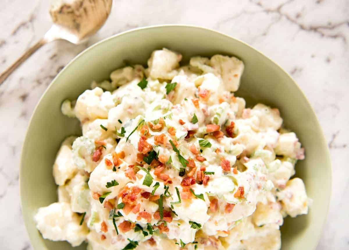 A classic potato salad made epic by pouring French dressing over the potatoes while cooked so it absorbs the flavour. The BEST potato salad I've ever had! staging.recipetineats.com