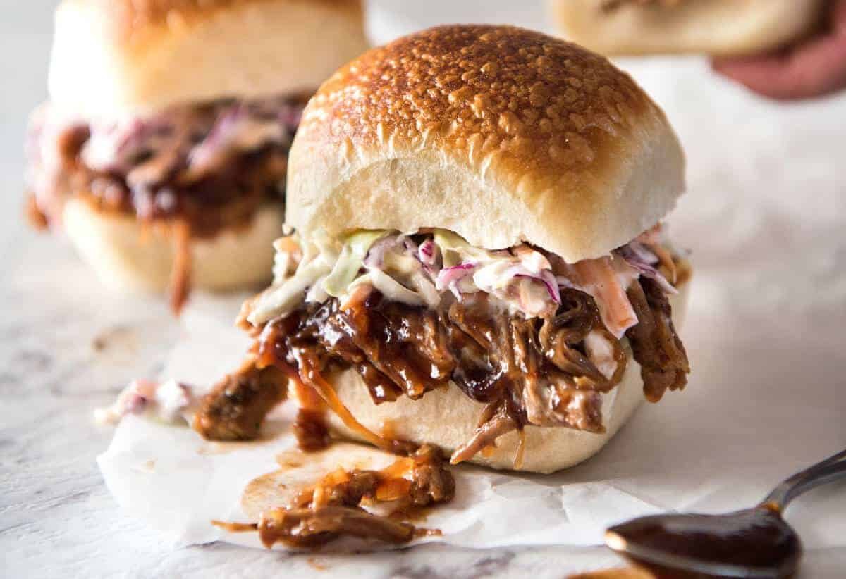 Slow Cooker BBQ Pulled Pork Sandwich - Perfectly seasoned, tender pulled pork tossed in a homemade BBQ sauce, piled onto bread with coleslaw. Slow cooker, pressure cooker or oven. staging.recipetineats.com