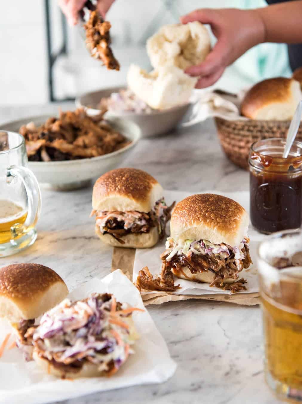 Slow Cooker BBQ Pulled Pork Sandwich - Perfectly seasoned, tender pulled pork tossed in a homemade BBQ sauce, piled onto bread with coleslaw. Slow cooker, pressure cooker or oven. staging.recipetineats.com