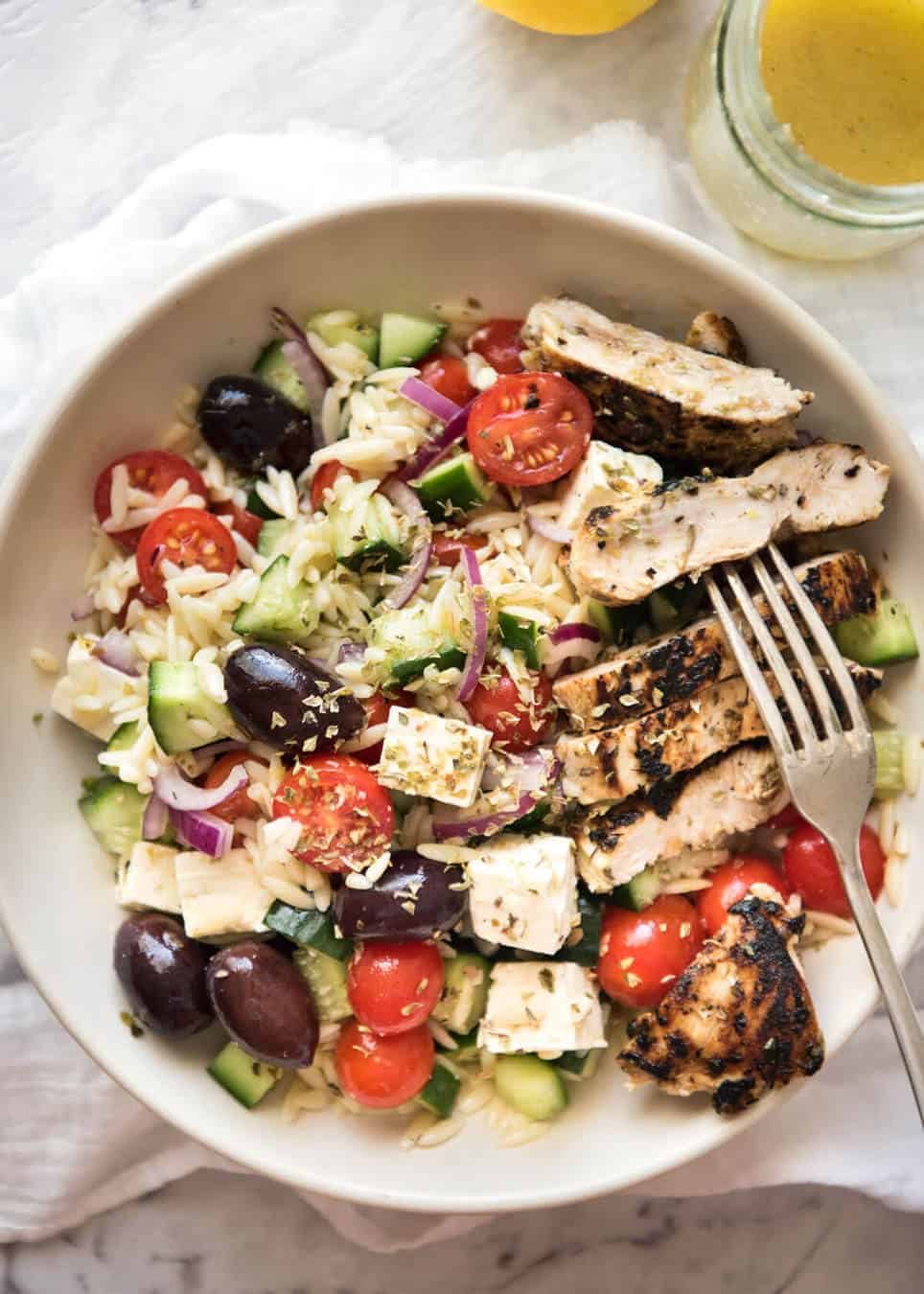 Greek Lemon Orzo Salad (Risoni) - All the fixings of a Greek Salad tossed through orzo / risoni and dressed with a gorgeous zesty lemon vinaigrette. staging.recipetineats.com