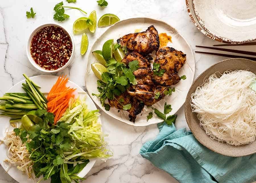 Overhead photo of Vietnamese Noodles with Lemongrass Chicken DIY spread - meal idea for large groups