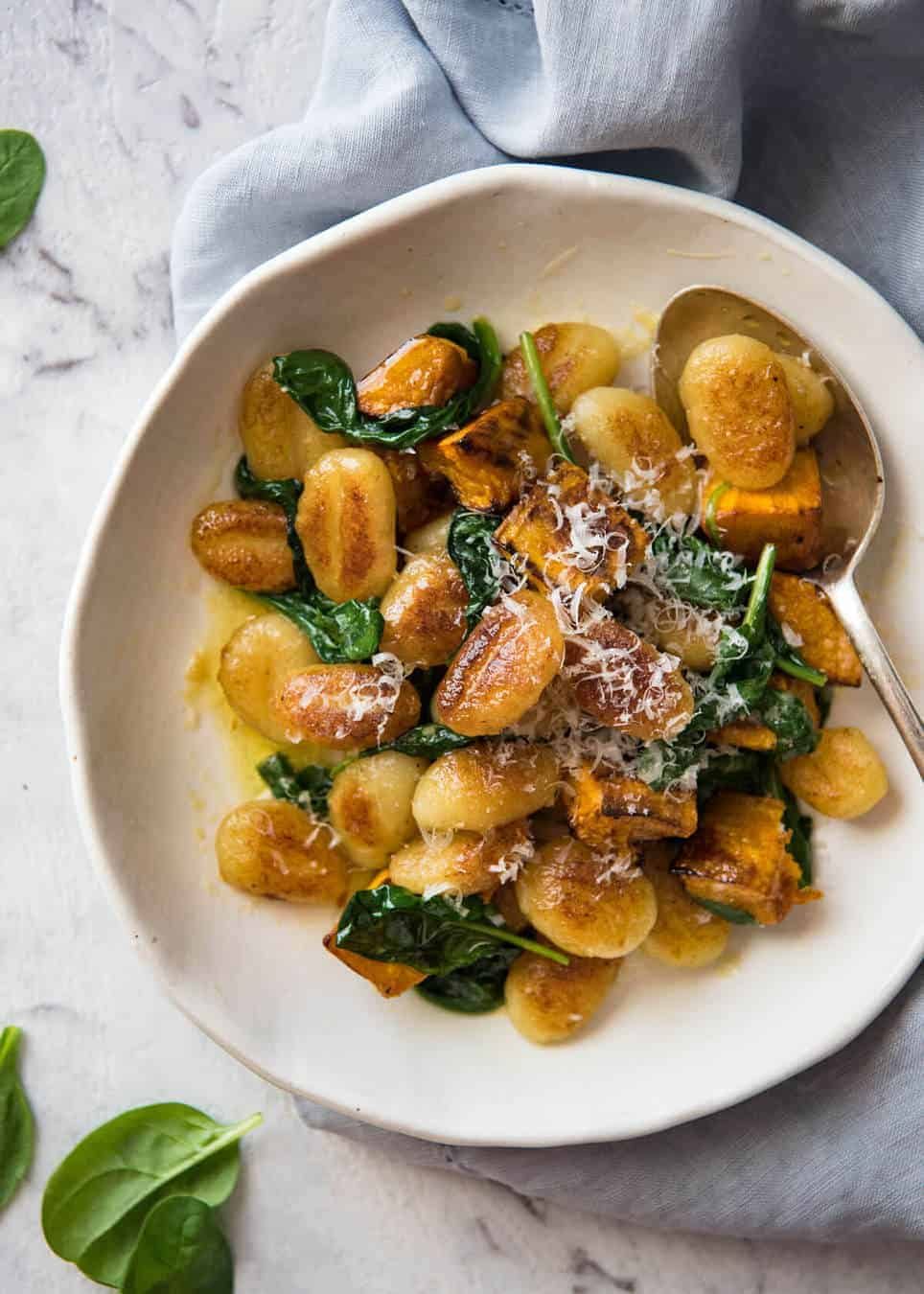 Pan Fried Gnocchi with Pumpkin and Spinach - Golden crispy on the outside, soft on the inside, with a butter sage sauce, roasted pumpkin and spinach. staging.recipetineats.com