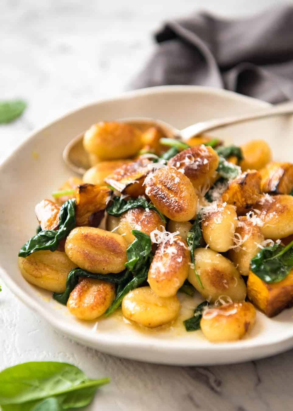 Pan Fried Gnocchi with Pumpkin and Spinach - Golden crispy on the outside, soft on the inside, with a butter sage sauce, roasted pumpkin and spinach. staging.recipetineats.com