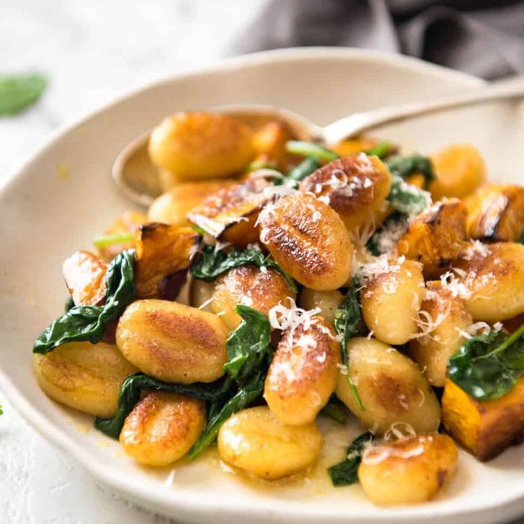 Pan Fried Gnocchi with Pumpkin and Spinach - Golden crispy on the outside, soft on the inside, with a butter sage sauce, roasted pumpkin and spinach. staging.recipetineats.com