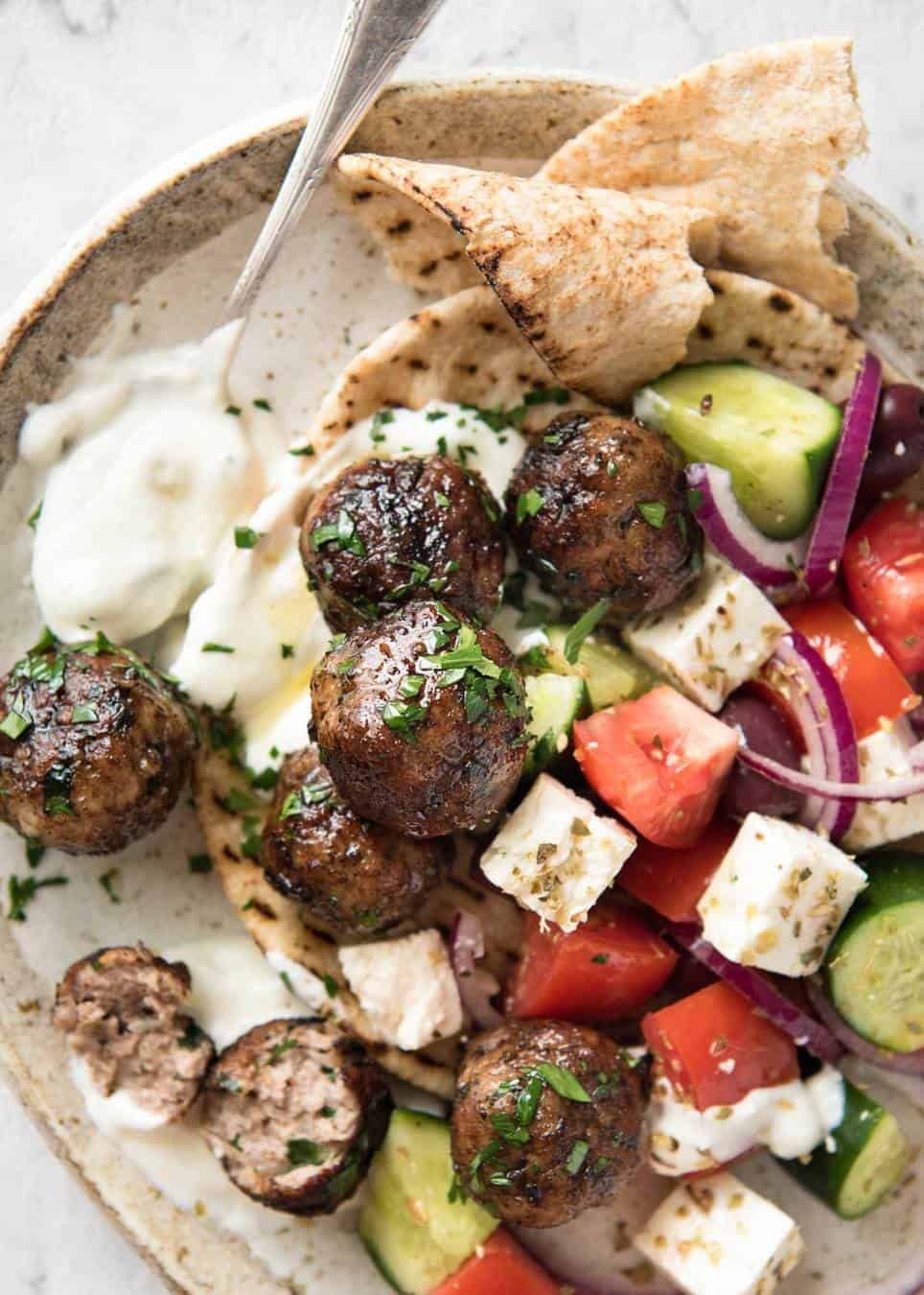 Soft, juicy, beautifully flavoured GREEK MEATBALLS! Serve as an appetiser with tzatziki, main with Greek Salad or make wraps! staging.recipetineats.com