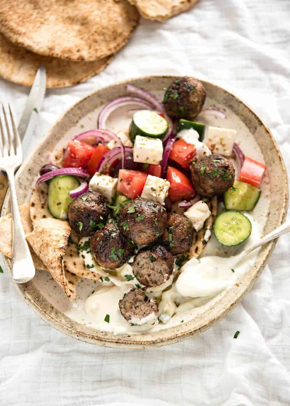 Soft, juicy, beautifully flavoured GREEK MEATBALLS! Serve as an appetiser with tzatziki, main with Greek Salad or make wraps! staging.recipetineats.com