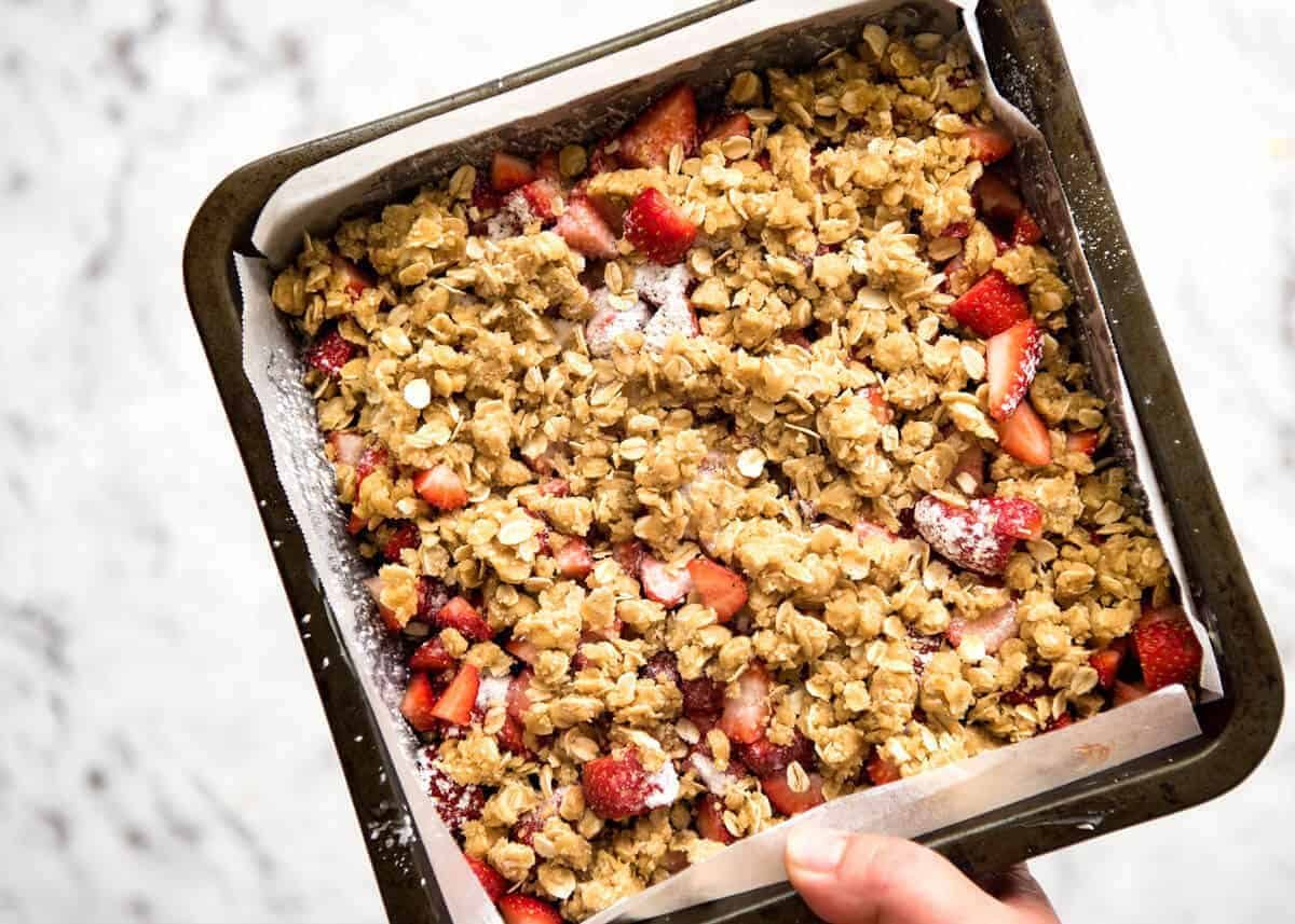 Fresh Strawberry Bars with a buttery biscuit base, topped with jam, fresh strawberries and a crumbly topping. No mixer, quick to make! staging.recipetineats.com
