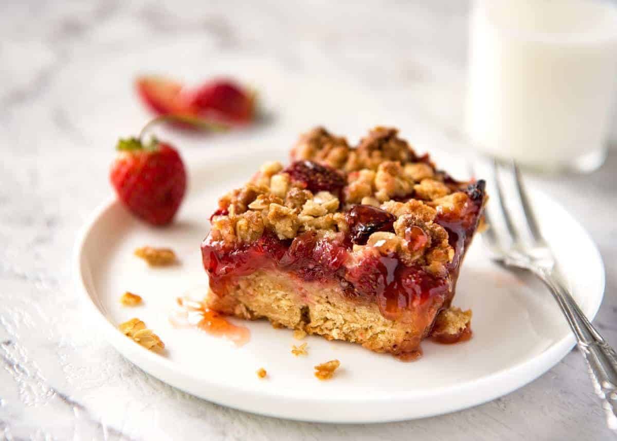 Fresh Strawberry Bars with a buttery biscuit base, topped with jam, fresh strawberries and a crumbly topping. No mixer, quick to make! staging.recipetineats.com