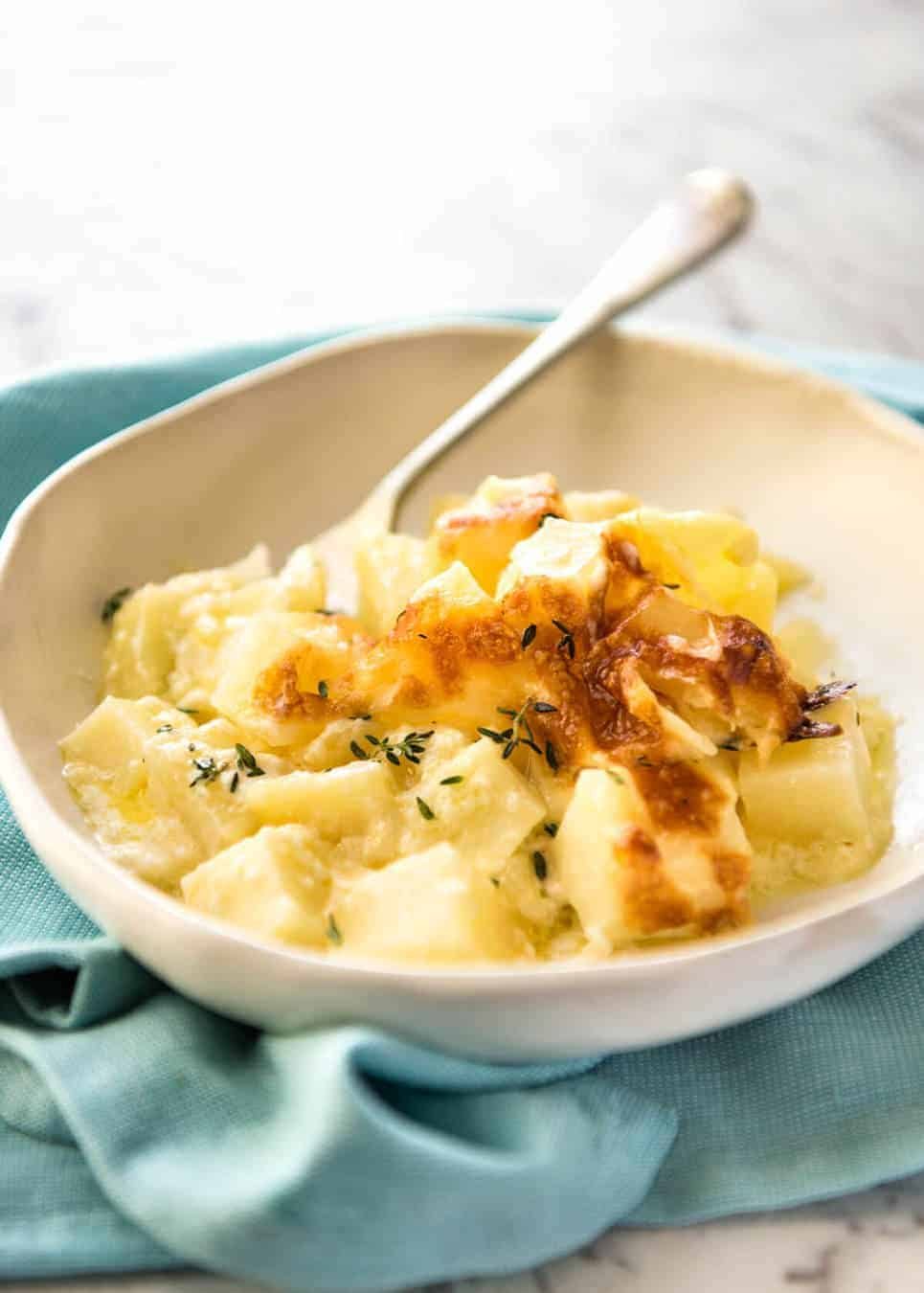 A faster, cheesier, creamier alternative to Scalloped Potatoes / Potato Gratin, this Easy Creamy Cheesy Potato Bake is made with cubed potatoes cooked in a cream and cheese sauce. staging.recipetineats.com