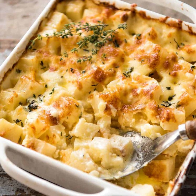 A faster, cheesier, creamier alternative to Scalloped Potatoes / Potato Gratin, this Easy Creamy Cheesy Potato Bake is made with cubed potatoes cooked in a cream and cheese sauce. staging.recipetineats.com