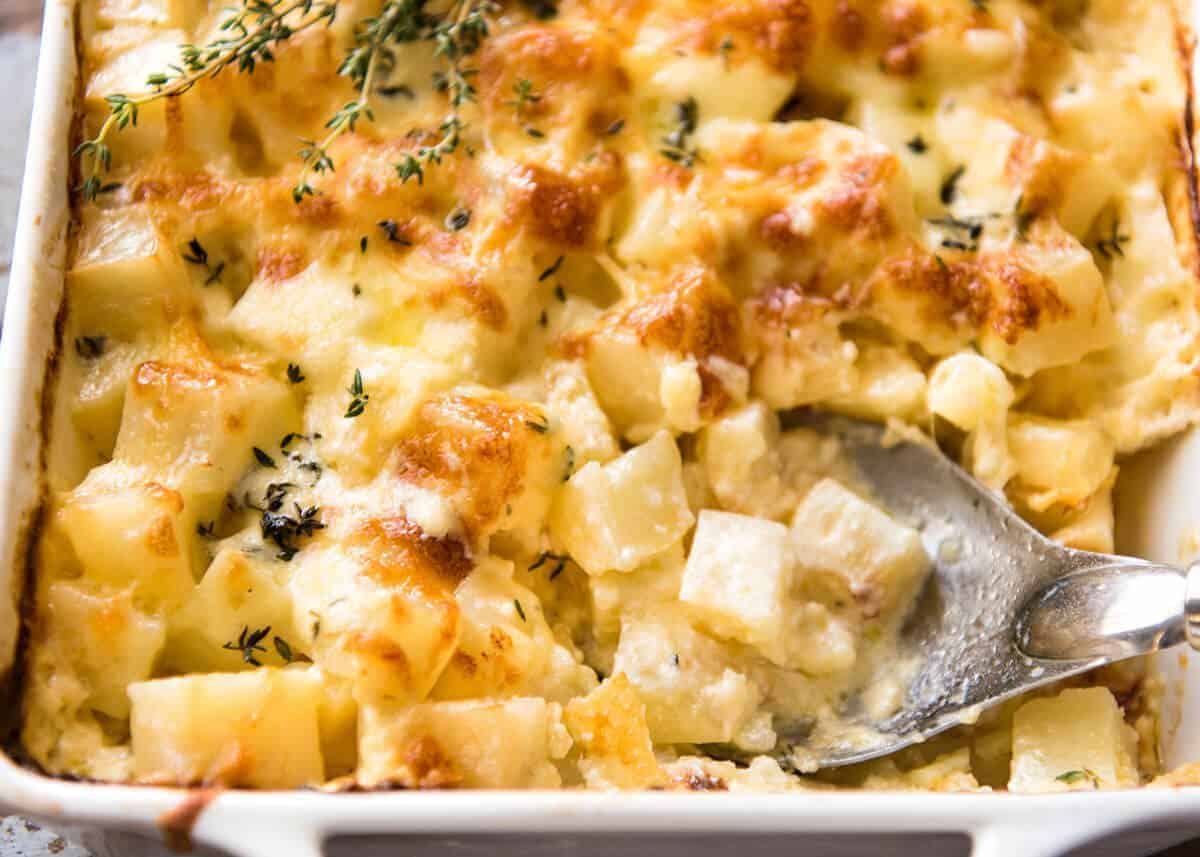 A faster, cheesier, creamier alternative to Scalloped Potatoes / Potato Gratin, this Easy Creamy Cheesy Potato Bake is made with cubed potatoes cooked in a cream and cheese sauce. staging.recipetineats.com