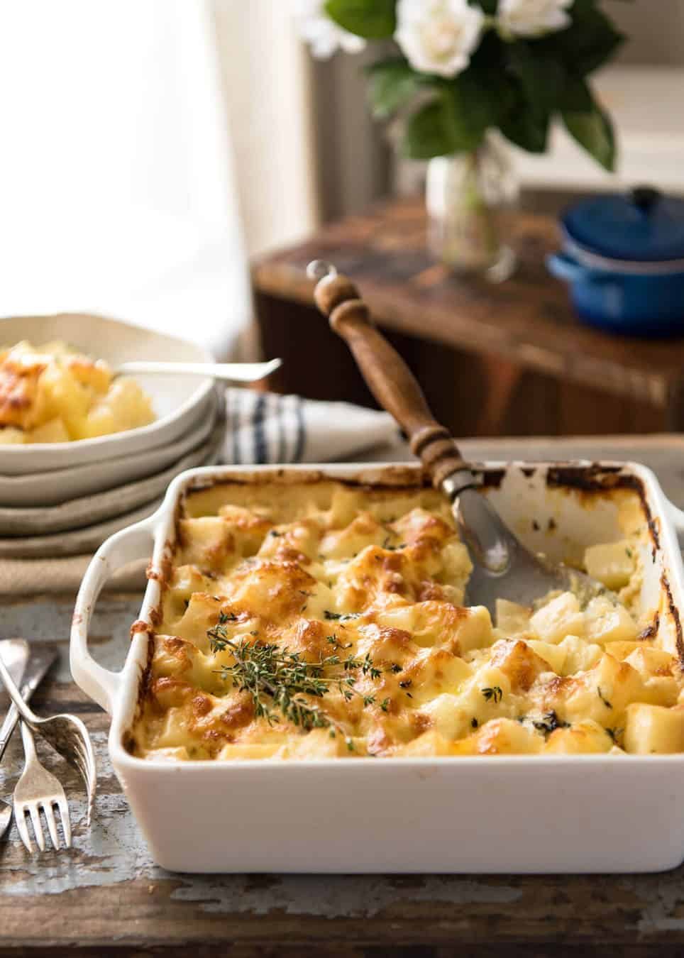 A faster, cheesier, creamier alternative to Scalloped Potatoes / Potato Gratin, this Easy Creamy Cheesy Potato Bake is made with cubed potatoes cooked in a cream and cheese sauce. staging.recipetineats.com