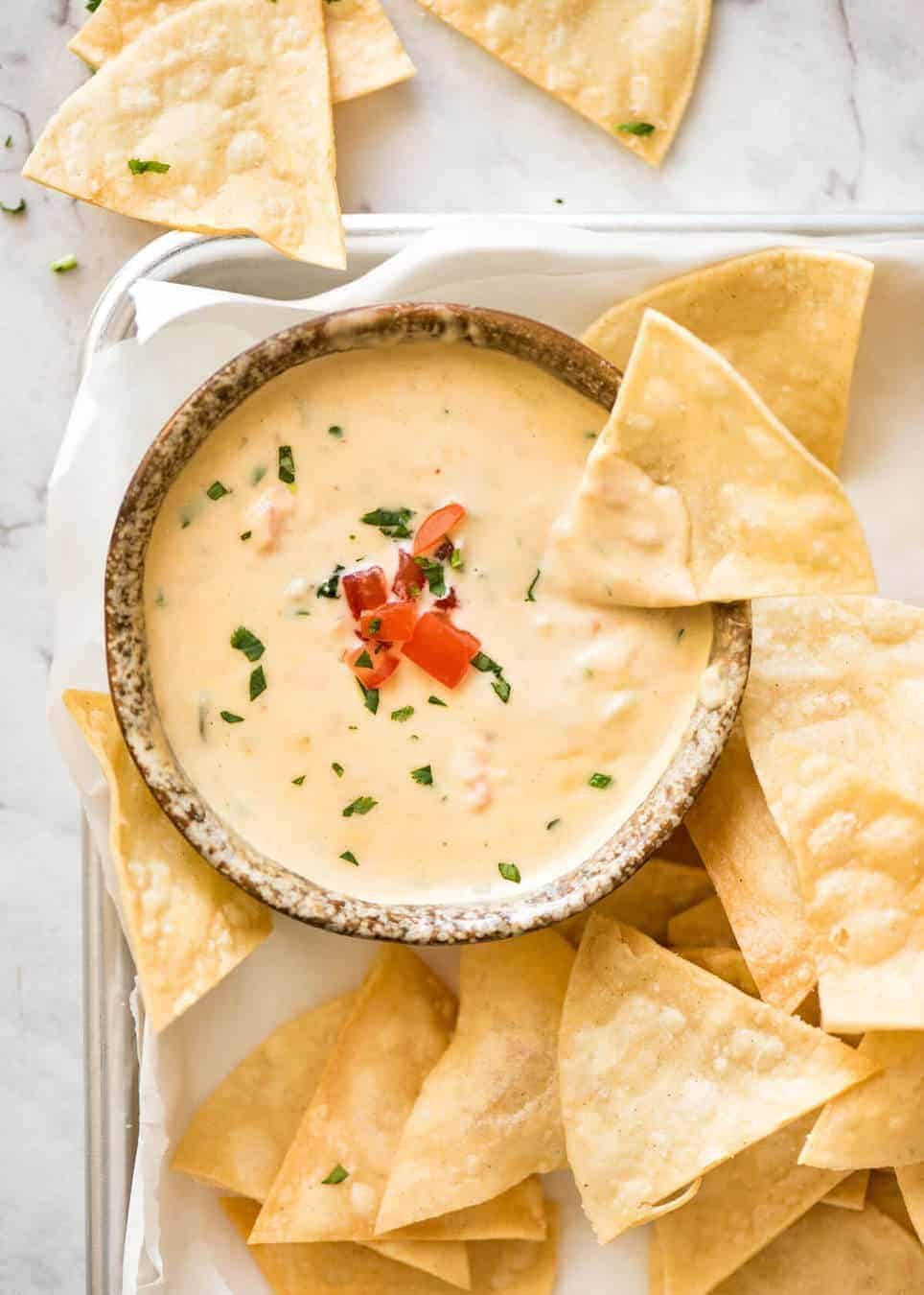 Code cracked: Queso Dip made with real cheese that's ultra silky even when it cools. staging.recipetineats.com