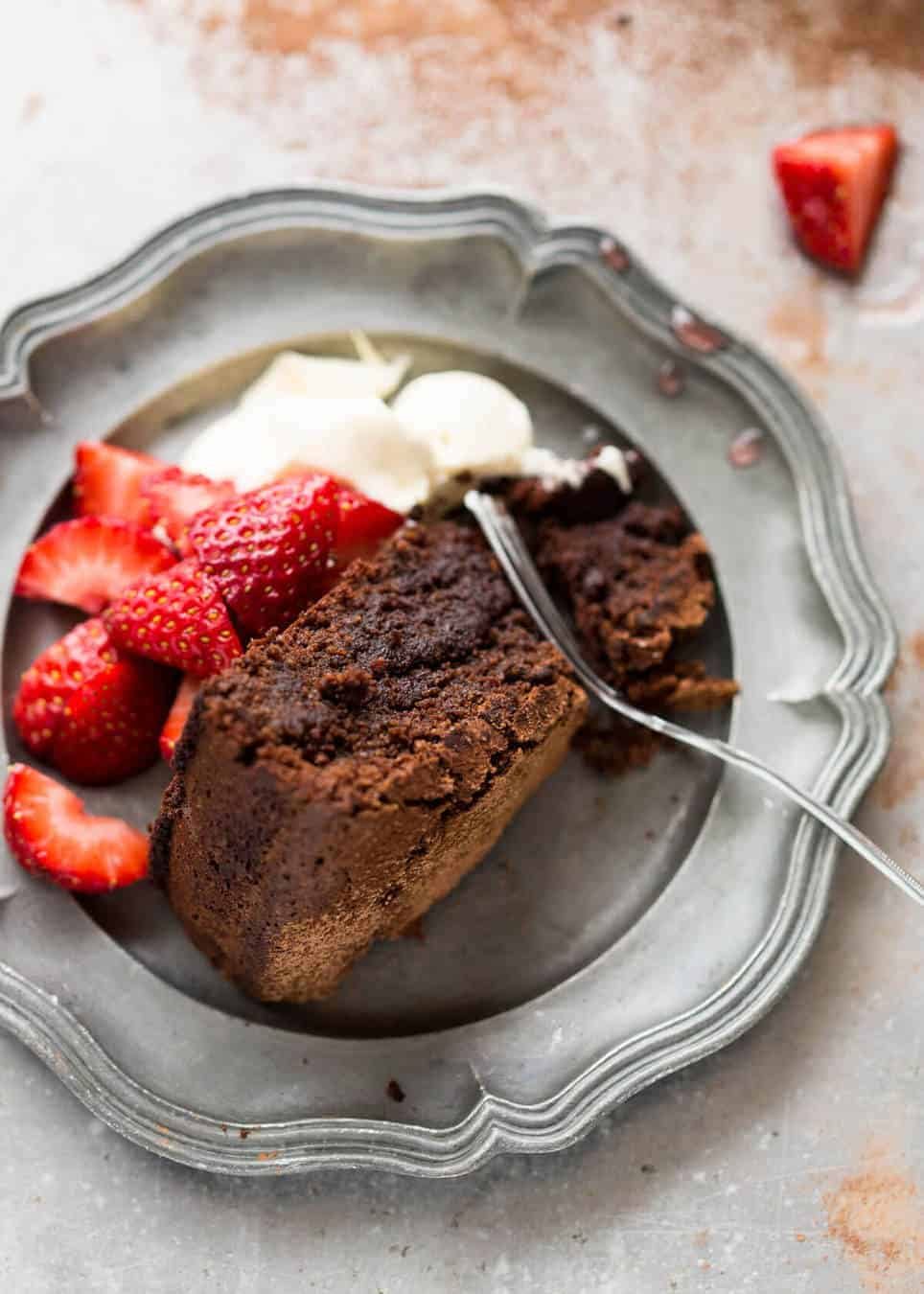 A simple Flourless Chocolate Cake made with almond meal / almond flour. Moist inside, with a thin crackly brownie-like surface. A stunning, very quick cake to make! staging.recipetineats.com
