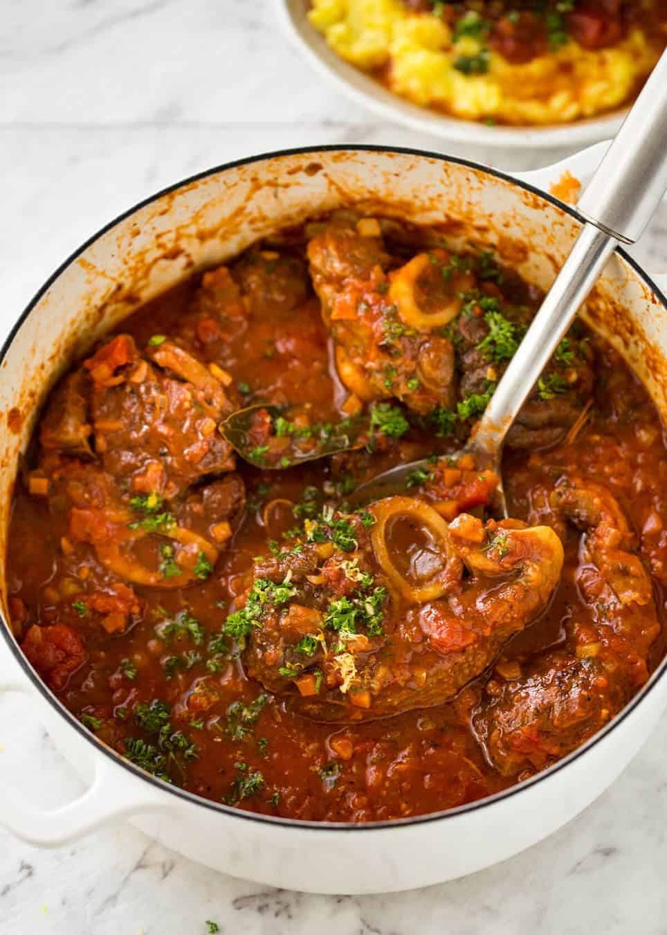 Fork tender veal braised in a rich red sauce, Osso Buco is a meal fit for a king! staging.recipetineats.com