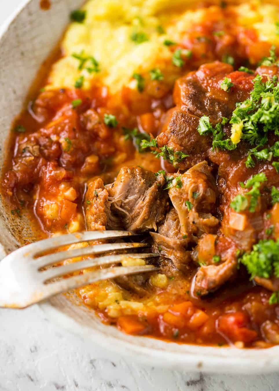 Fork tender veal braised in a rich red sauce, Osso Buco is a meal fit for a king! staging.recipetineats.com