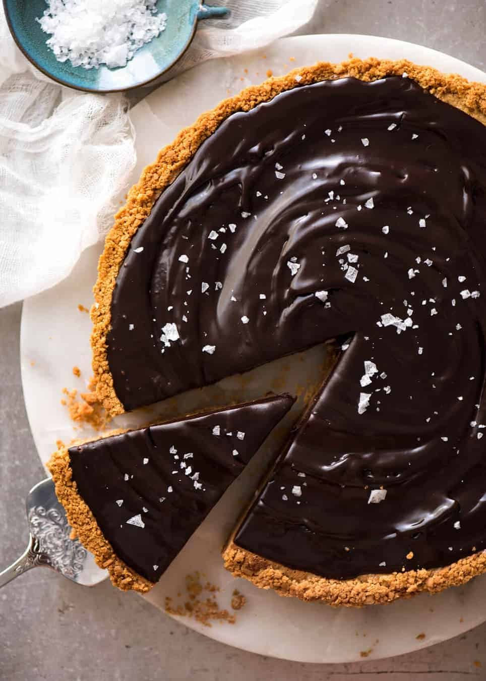 A sinfully decadent Salted Caramel Tart with a creamy soft salted caramel filling topped with luxurious chocolate ganache. Just SIX ingredients! staging.recipetineats.com