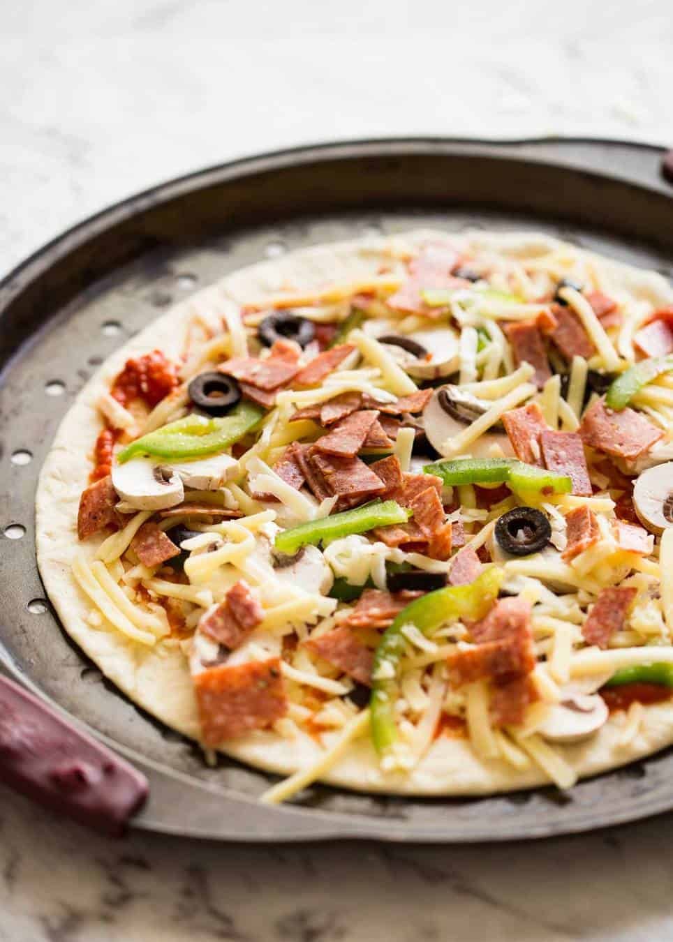 How to bake Crispy Base Pizza using Flatbread staging.recipetineats.com