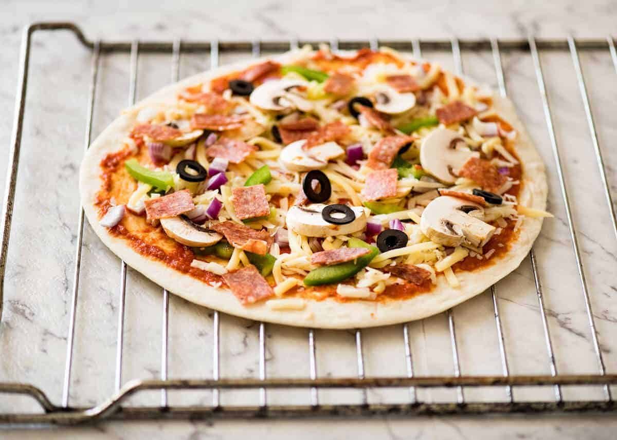 How to bake Crispy Base Pizza using Flatbread staging.recipetineats.com