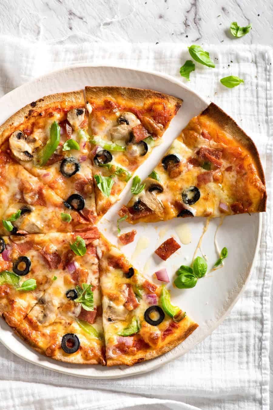 $2 Homemade Frozen Pizzas - quick and easy made using flatbreads, cook from frozen for a terrific Thin & Crispy pizza! staging.recipetineats.com