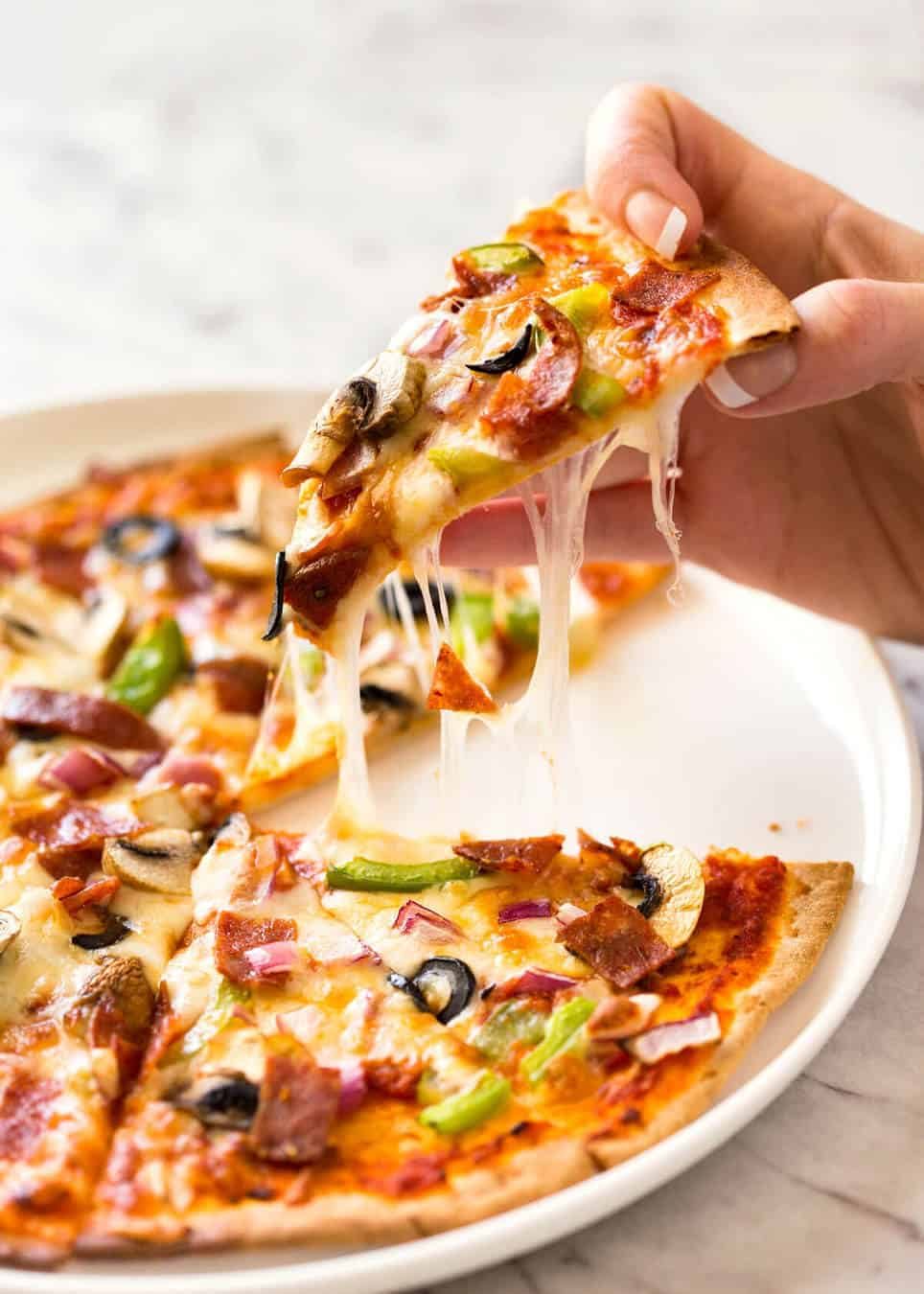 $2 Homemade Frozen Pizzas - quick and easy made using flatbreads, cook from frozen for a terrific Thin & Crispy pizza! staging.recipetineats.com