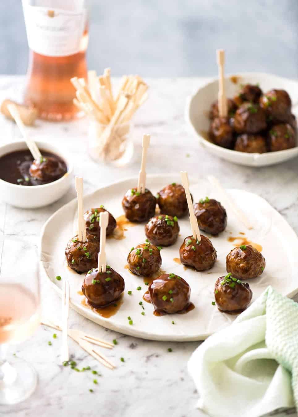 Plump, juicy and soft, these Party Cocktail Meatballs are baked and served with a fabulous Sweet & Sour Dipping Sauce that's super quick to make. Great make ahead for parties! staging.recipetineats.com