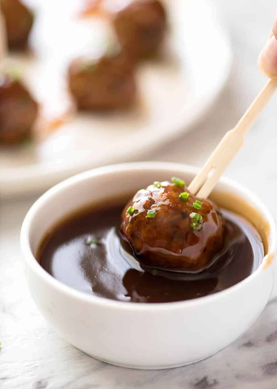 Plump, juicy and soft, these Party Cocktail Meatballs are baked and served with a fabulous Sweet & Sour Dipping Sauce that's super quick to make. Great make ahead for parties! staging.recipetineats.com