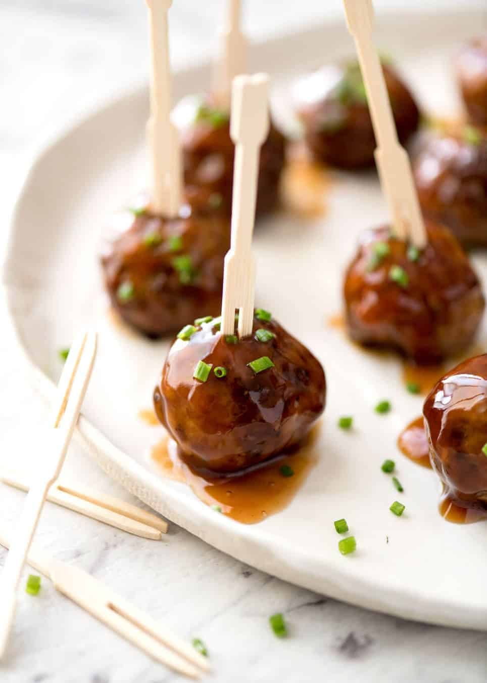 Plump, juicy and soft, these Party Cocktail Meatballs are baked and served with a fabulous Sweet & Sour Dipping Sauce that's super quick to make. Great make ahead for parties! staging.recipetineats.com