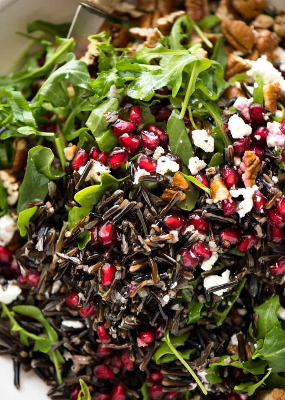 This Wild Rice Salad is a salad for celebrations! Stellar flavour combination - wild rice, pomegranate, pecans, rocket / arugula, green onions, cranberries and feta. staging.recipetineats.com