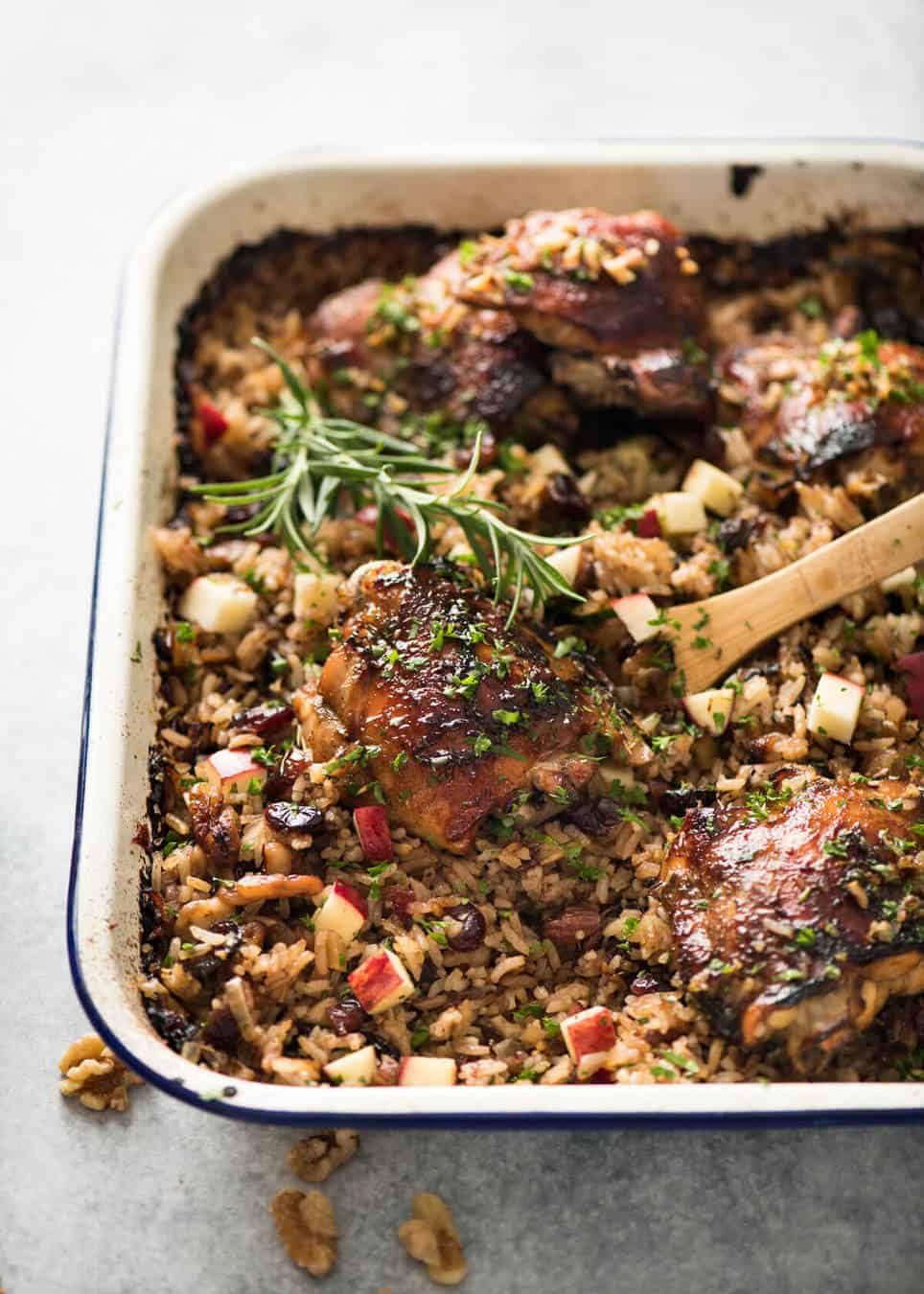 A flavour loaded one-pan, quick midweek dinner - Baked Chicken and Rice Pilaf with Cranberries, Walnuts and Apple. The smell when this is cooking is amazing! staging.recipetineats.com