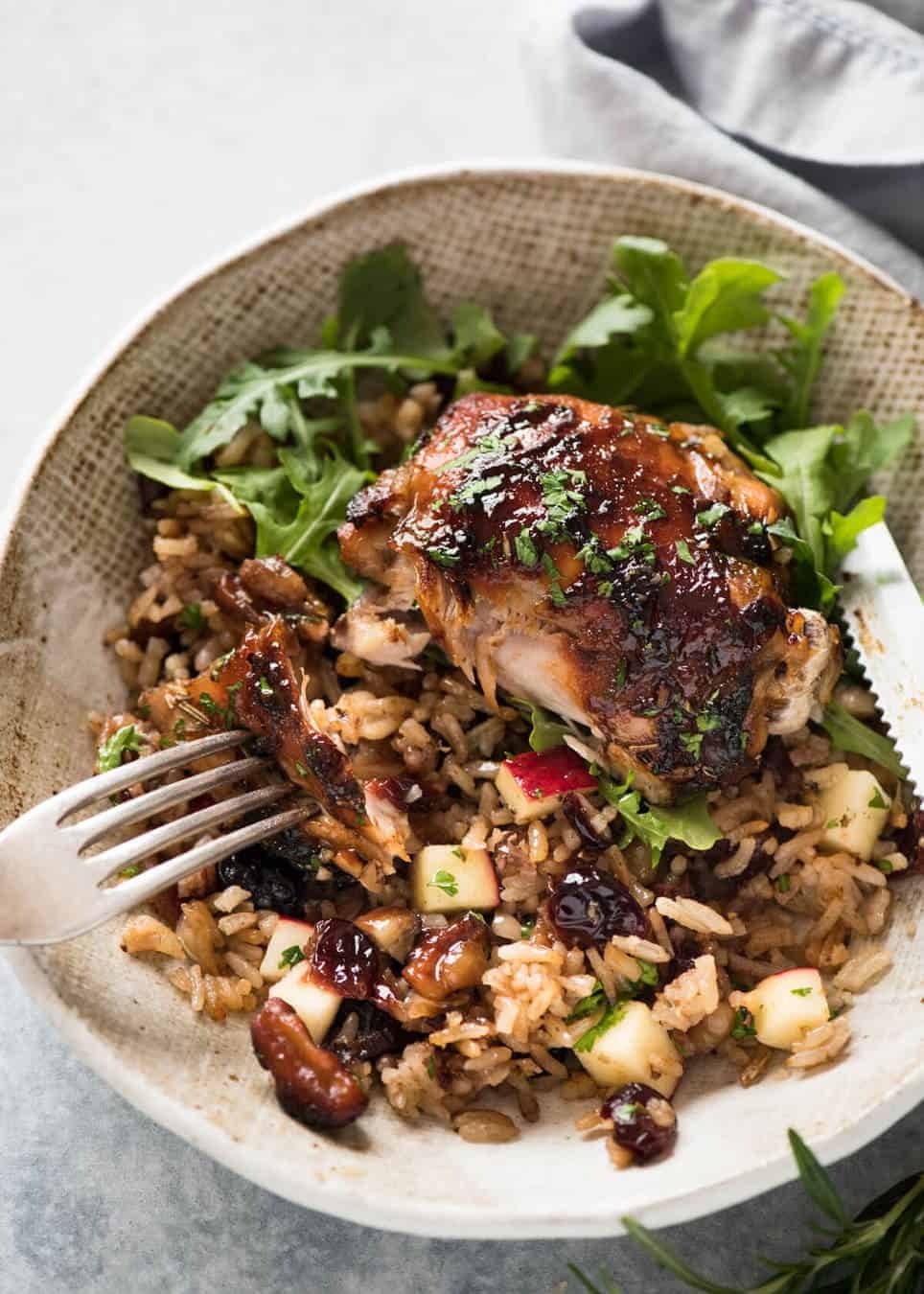 A flavour loaded one-pan, quick midweek dinner - Baked Chicken and Rice Pilaf with Cranberries, Walnuts and Apple. The smell when this is cooking is amazing! staging.recipetineats.com