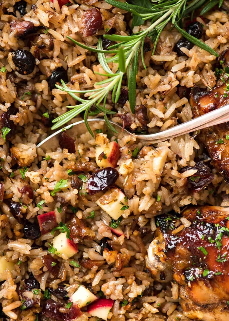 A flavour loaded one-pan, quick midweek dinner - Baked Chicken and Rice Pilaf with Cranberries, Walnuts and Apple. The smell when this is cooking is amazing! staging.recipetineats.com