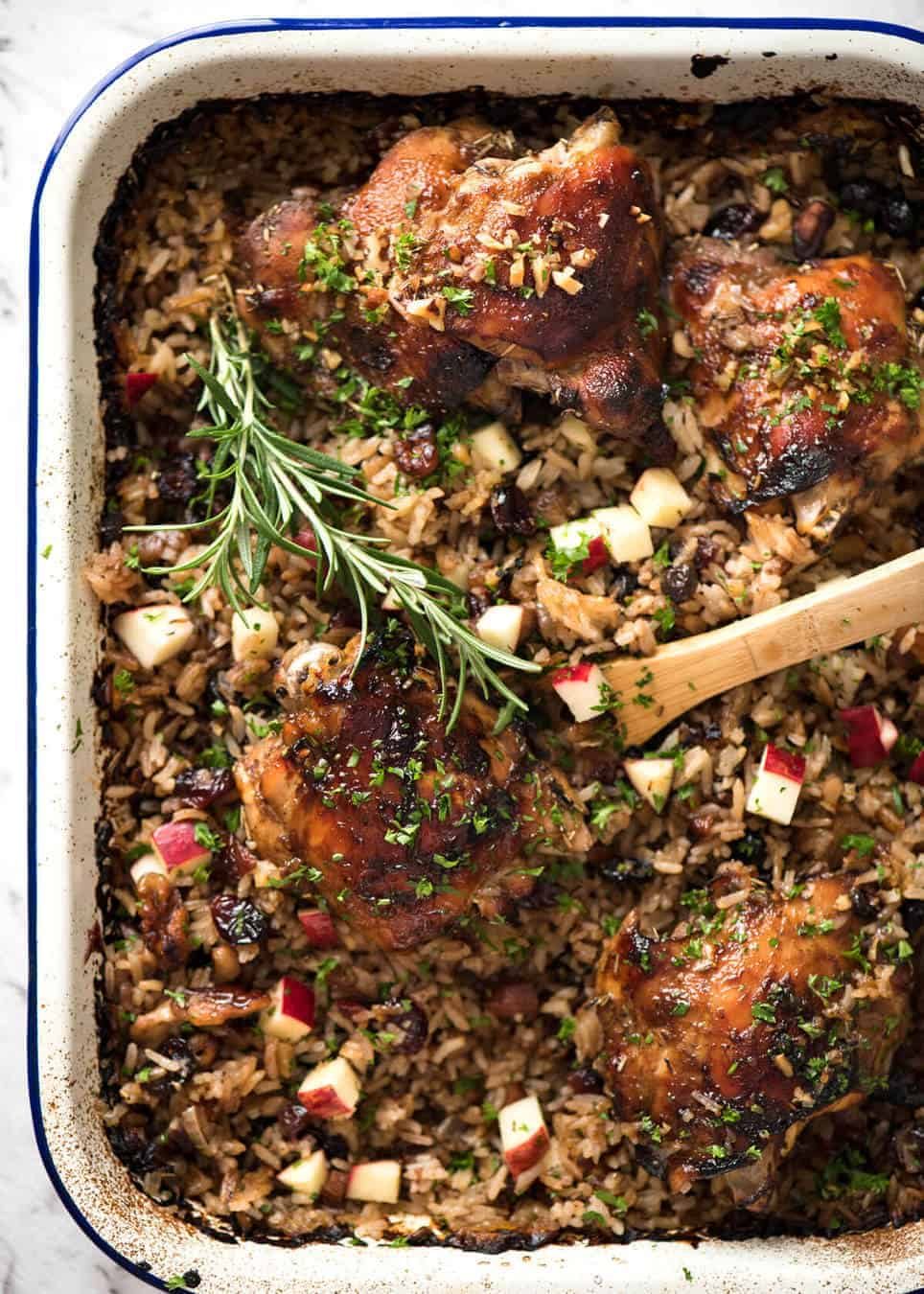A flavour loaded one-pan, quick midweek dinner - Baked Chicken and Rice Pilaf with Cranberries, Walnuts and Apple. The smell when this is cooking is amazing! staging.recipetineats.com