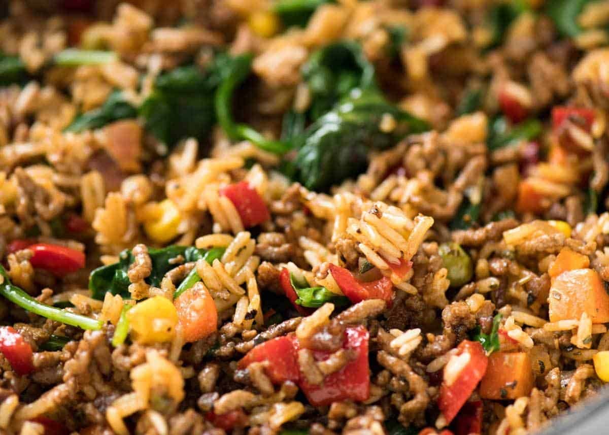A quick, fabulous midweek meal - this ground Beef and Rice is made by browning ground beef, then cooking it with flavoured rice and loads of veggies. Irresistibly delicious! staging.recipetineats.com