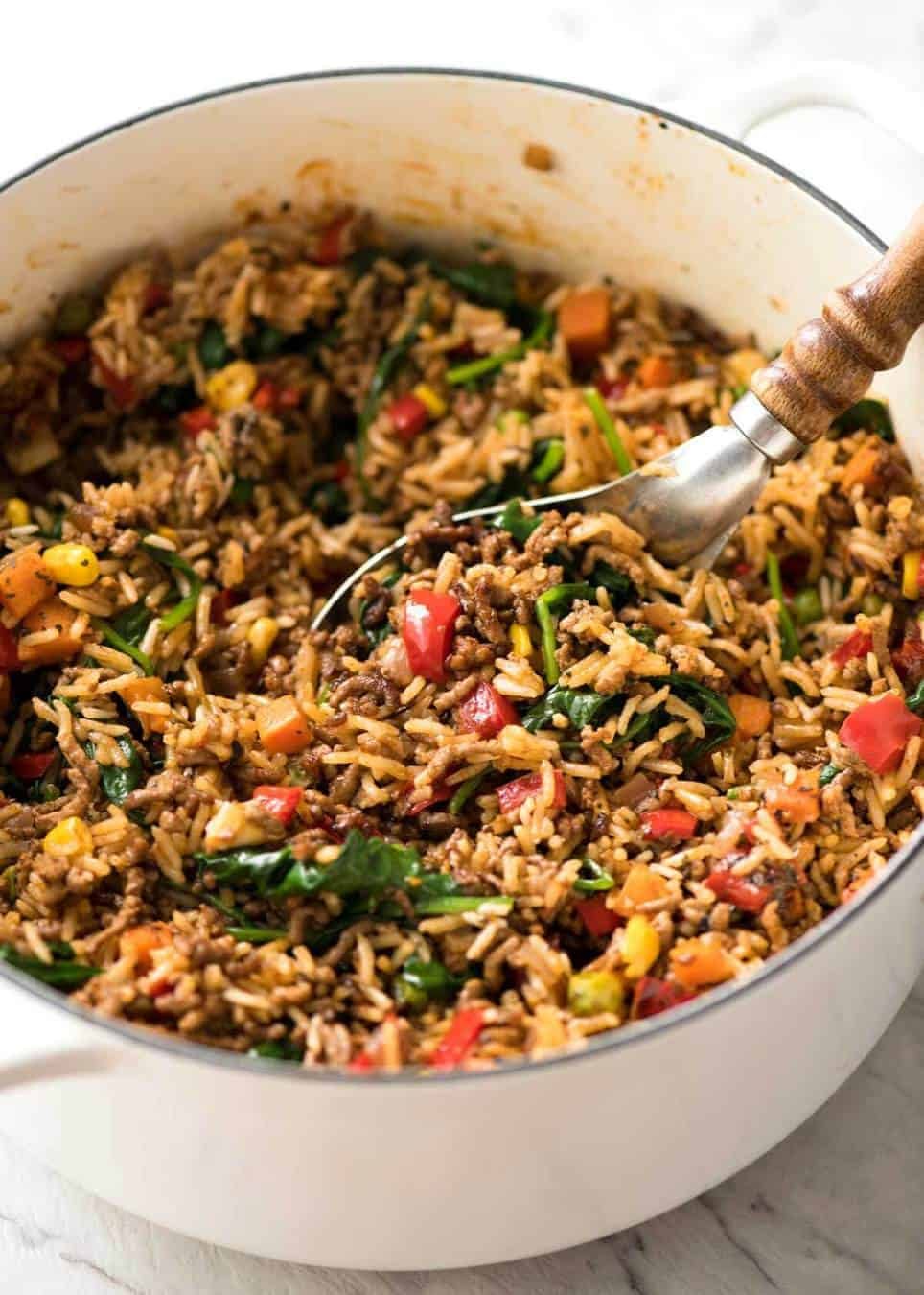 A quick, fabulous midweek meal - this ground Beef and Rice is made by browning ground beef, then cooking it with flavoured rice and loads of veggies. Irresistibly delicious! staging.recipetineats.com